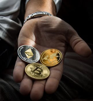 pexels photo 1097946 1097946 Hand holding Bitcoin, Ethereum, and Ripple coins representing digital currency.