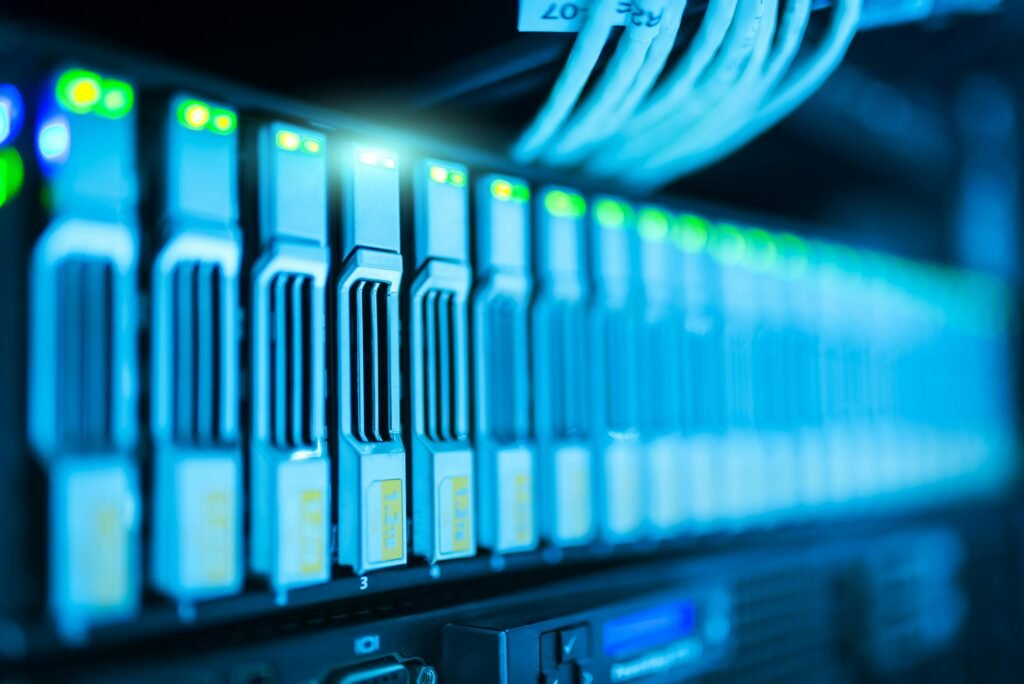 pexels photo 1148820 1148820 Detailed image of a server rack with glowing lights in a modern data center.