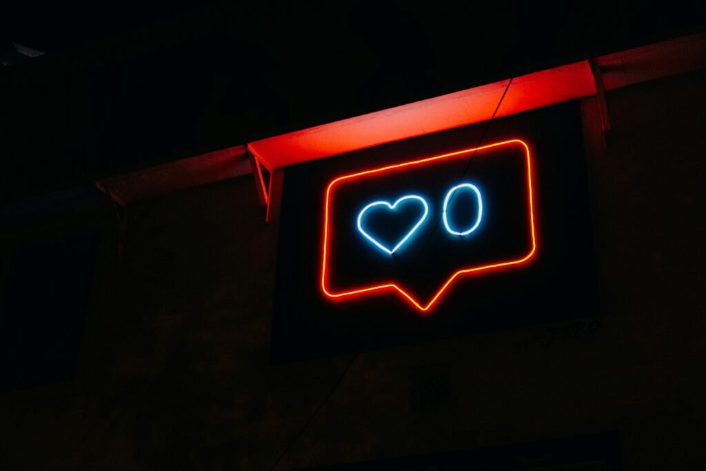 pexels photo 2694434 2694434 Bright neon heart icon with zero likes, symbolizing social media engagement.